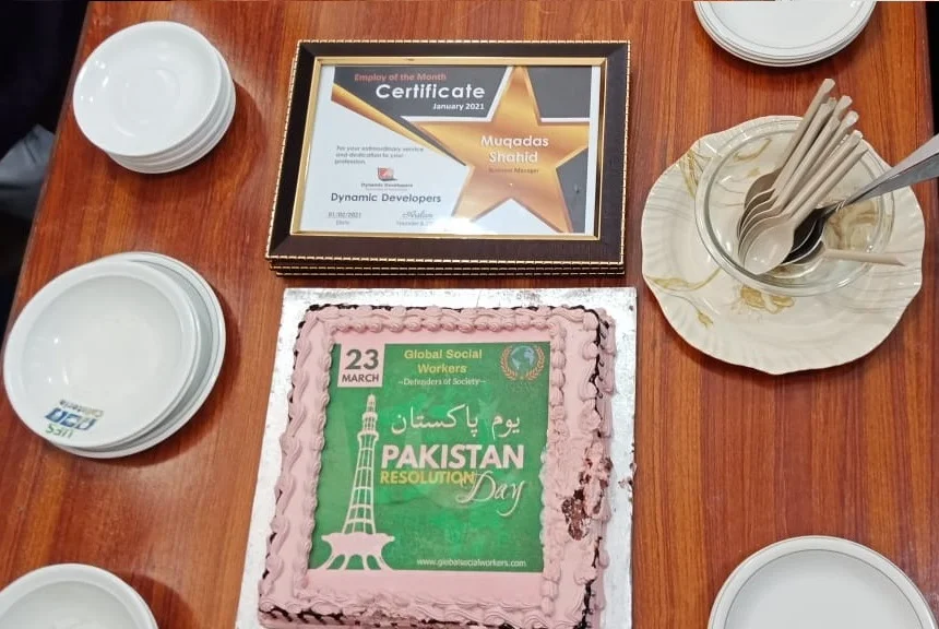 Cake cutting ceremony of Pakistan Day by Dynamic Developers
